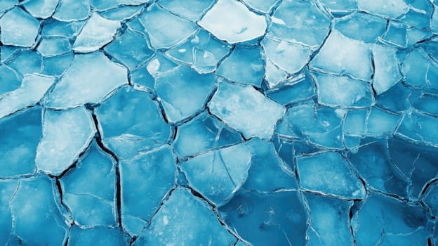 The surface showcases fractured ice pieces in varying sizes, creating a mosaic against the vivid turquoise water beneath on a bright winter day.