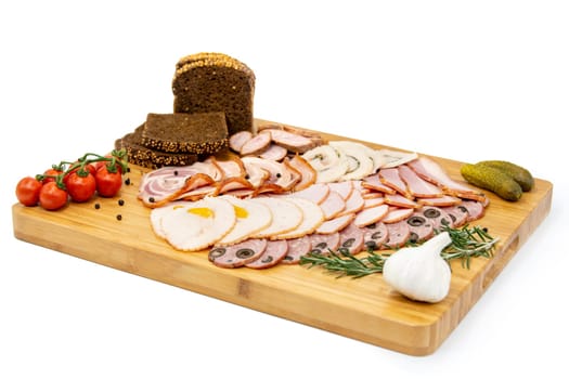 Various meat cold cut platter on a wooden board