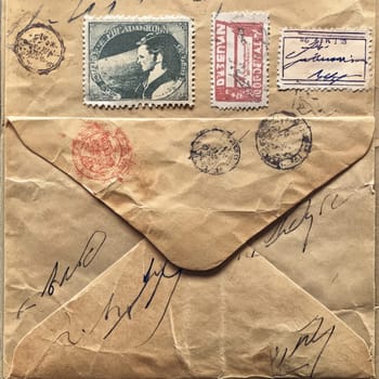 An old envelope with vintage stamps and various postal markings showcases handwritten addresses and notes, reflecting 19th-century communication styles.