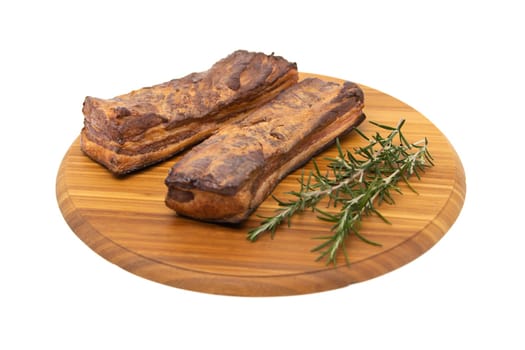 Delicious artisanal whole smoked slab bacon on a cutting block.