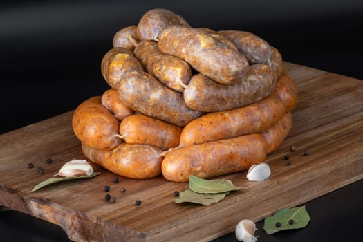 A colorful display of gourmet sausages on a rustic wooden board, garnished with spices to enhance flavor