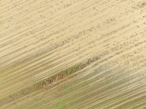 Overhead Aerial view of a flooded fields showcasing the impact of unusual heavy rainfall on rural landscapes during autumn