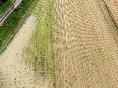 Overhead Aerial view of a flooded fields showcasing the impact of unusual heavy rainfall on rural landscapes during autumn