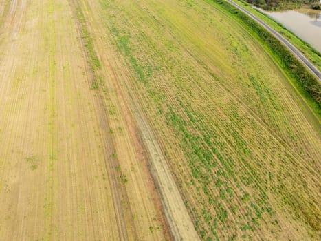 Overhead Aerial view of a flooded fields showcasing the impact of unusual heavy rainfall on rural landscapes during autumn