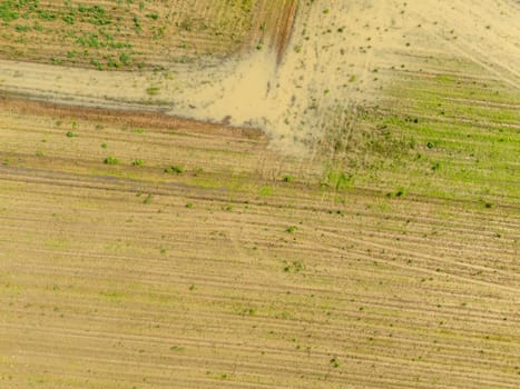Overhead Aerial view of a flooded fields showcasing the impact of unusual heavy rainfall on rural landscapes during autumn