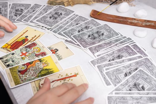 TVER, RUSSIA - FEBRUARY 18, 2024. Tarot cards, Tarot card divination, fortune telling. Occultism, esoteric education