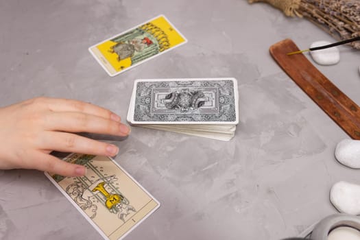 TVER, RUSSIA - FEBRUARY 18, 2024. Tarot cards, Tarot card divination, fortune telling. Occultism, esoteric education
