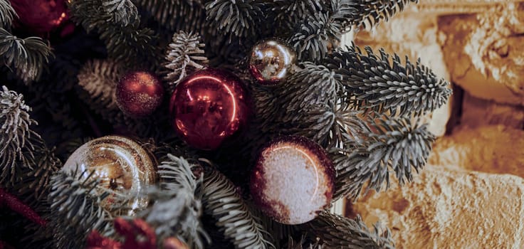 Background for Christmas and New Year's Eve. Beautiful wide angle holiday template with Christmas ball on the tree and glare.