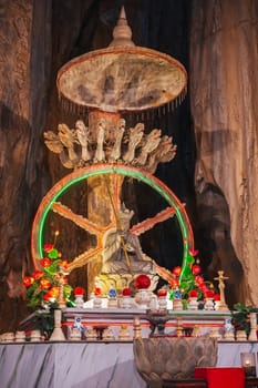 Buddhist Buddha statue and altar inside Asian temple in the Am Phu Cave in Marble Mountains in Da Nang in Vietnam in Asia