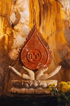 Buddhist statue inside Asian sacred temple in the Am Phu Cave in the Marble Mountains in Da Nang in Vietnam in Asia
