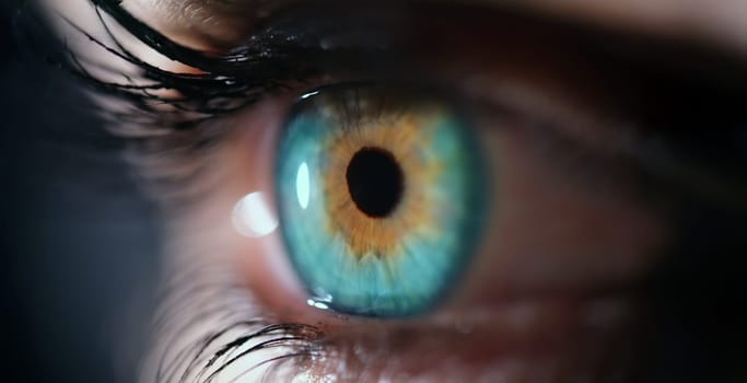 A breathtaking closeup image of a vibrant blue eye with amber colors, creating an alluring visual experience