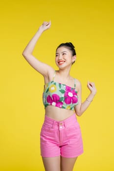 Happy young woman dancing in studio.