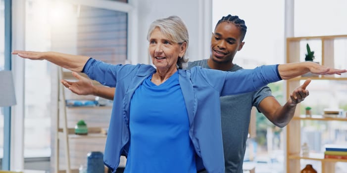 Elderly woman, nurse and rehabilitation or stretching exercise in a nursing home for fitness. Happy senior female patient with a therapist man for healing, health and physiotherapy for arms and body.