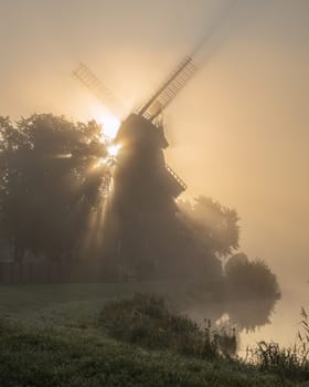 Hengstforder mill close to Bad Zwischenahn on a foggy morning, Lower Saxony, Germany