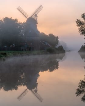 Hengstforder mill close to Bad Zwischenahn on a foggy morning, Lower Saxony, Germany