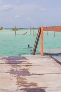 Turquoise waters of Bacalar Lake, Mexico. Peaceful and scenic tropical destination. Travel, relaxation, and nature concept.