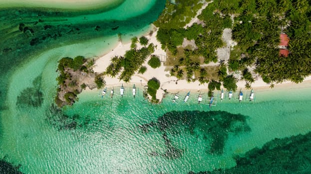 Seascape with tropical island and a sandy beach. Bantayan island, Philippines.