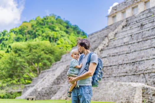 Mother with his toddler son exploring the ancient pyramids of Palenque, Mexico, surrounded by dense jungle. Cultural heritage and adventure travel concept.