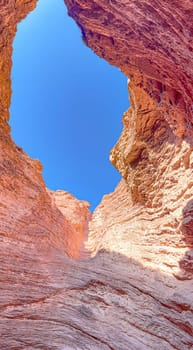 Vertical photo of rock formations in Salta, Quebrada de la Conchas.Used for promotions and advertisements for travel and tourism agencies. Ecological tourism. Exotic landscapes of northern Argentina.