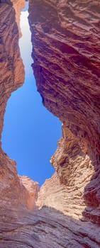 Vertical pic of red rock formations in Salta, Quebrada de la Conchas.Used for promotions and advertisements for travel and tourism agencies. Ecological tourism.