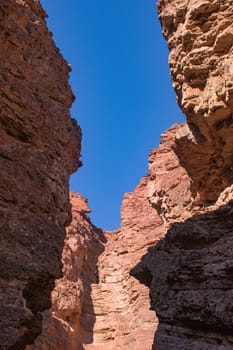 Vertical photo of rock formations in Salta, Quebrada de la Conchas.Used for promotions and advertisements for travel and tourism agencies. Ecological tourism. Exotic landscapes of northern Argentina.