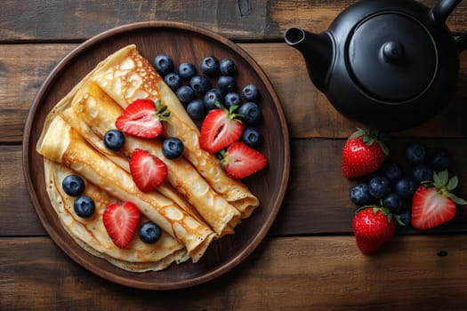Hot delicious pancakes decorated with blueberries and strawberries. High quality photo