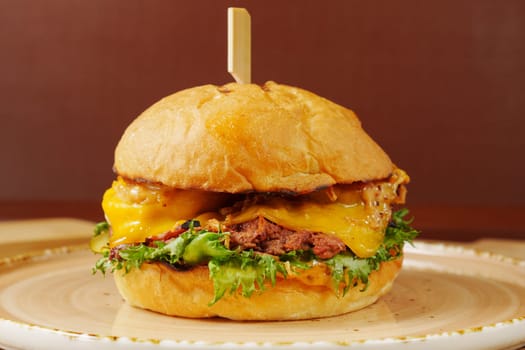 This delicious cheeseburger features two layers of melted cheese, crisp lettuce, and a succulent beef patty
