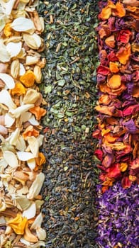 Colorful background is forming by dried flowers and tea leaves