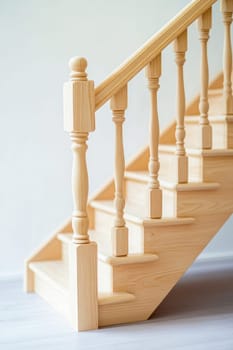 New wooden staircase connecting levels in a modern house with simple design and light colors