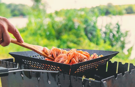 Grilling shrimp on a barbecue. Selective focus. food.