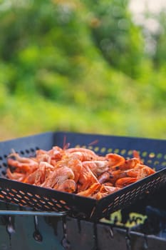 Grilling shrimp on a barbecue. Selective focus. food.