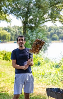 A man grills shashlik. Selective focus. food.