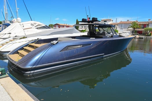 France, Port Grimaud: June 08, 2024, Luxury boat in Port Grimaud, Var, Provence-Alpes-Cote d'Azur, Provence, France, Mediterranean, Europe. High quality photo