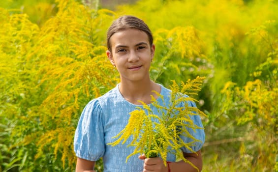 Child in ragweed flowers allergy. Selective focus. Kid.