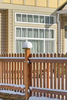 Bright sunny winter day on front yard of residential house in Canada.