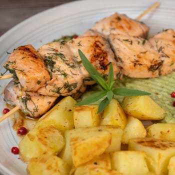 Barbecued salmon skewer with potatoes and broccoli Puree, High quality photo