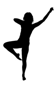 A graceful silhouette of a woman elegantly standing on one leg with her arms outstretched in an artistic pose that captures beauty