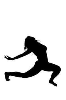 A beautiful silhouette of a woman gracefully stretching her legs against a bright white background, showcasing her form and movement
