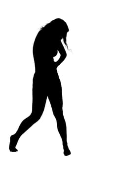 A striking silhouette of a woman confidently walking against a clean, minimalist white background, showcasing her fluid movement and grace