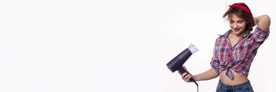 A fashionable and trendy woman skillfully using a hair dryer, showcasing her stylish look and vibrant energy with flair