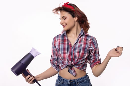 A vibrant and lively woman, dressed in a fashionable retro outfit, joyfully blowdrying her hair with excitement