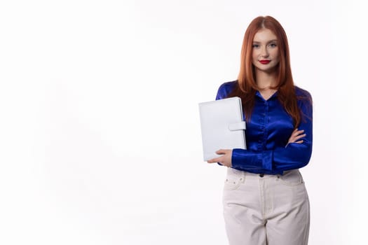 A confident businesswoman stands with her essential documents, showcasing her professionalism and stylish flair
