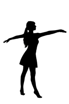 A striking silhouette of a woman standing outdoors with her arms outstretched wide to the sky, embracing the world around her
