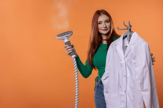A fashionforward young woman skillfully steaming a crisp white shirt for a polished and neat appearance