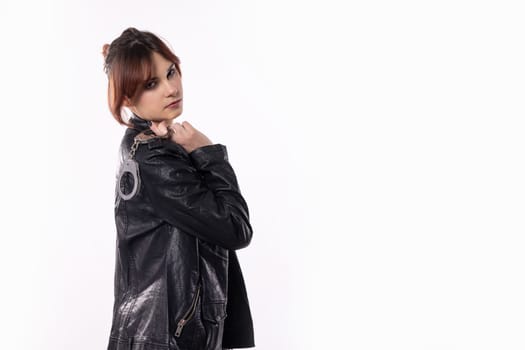 A stylish model confidently showcases a sleek leather jacket in a modern and striking pose against a clean background