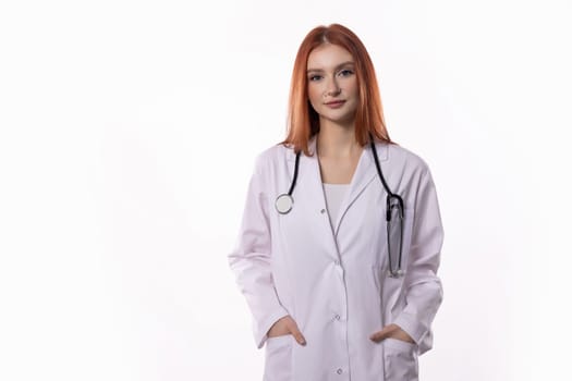 A confident female doctor in a crisp white coat and equipped with a stethoscope is fully prepared for patient care