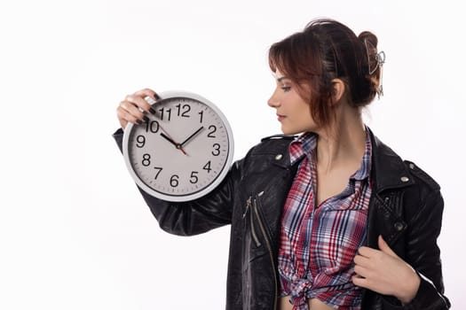 A chic and stylish woman showcases a beautifully designed clock, emphasizing the essential value of time management