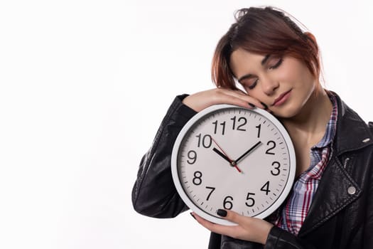 A young woman tenderly cradles a decorative clock, symbolizing the significance and value of time in our lives