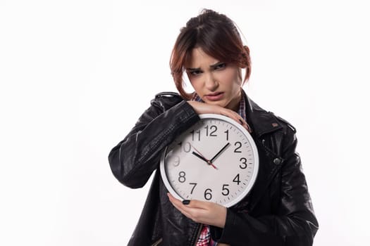 A woman holding a clock has a concerned expression on her face, embodying the themes of time and stress