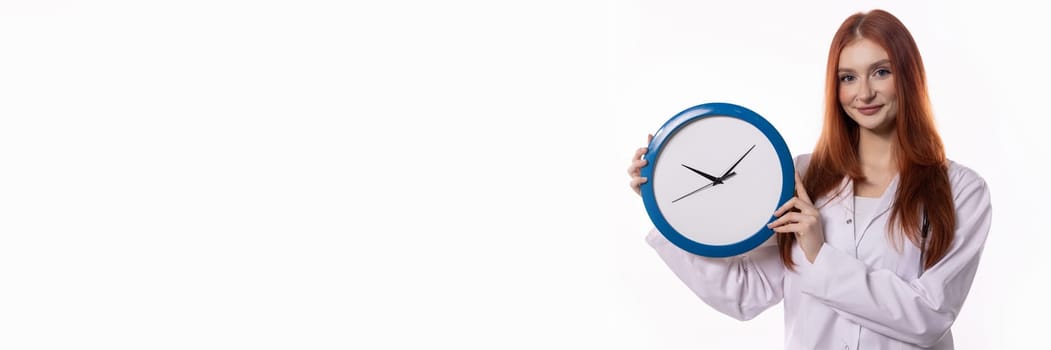 A young woman with long hair is proudly displaying a vibrant blue clock, symbolizing effective time management